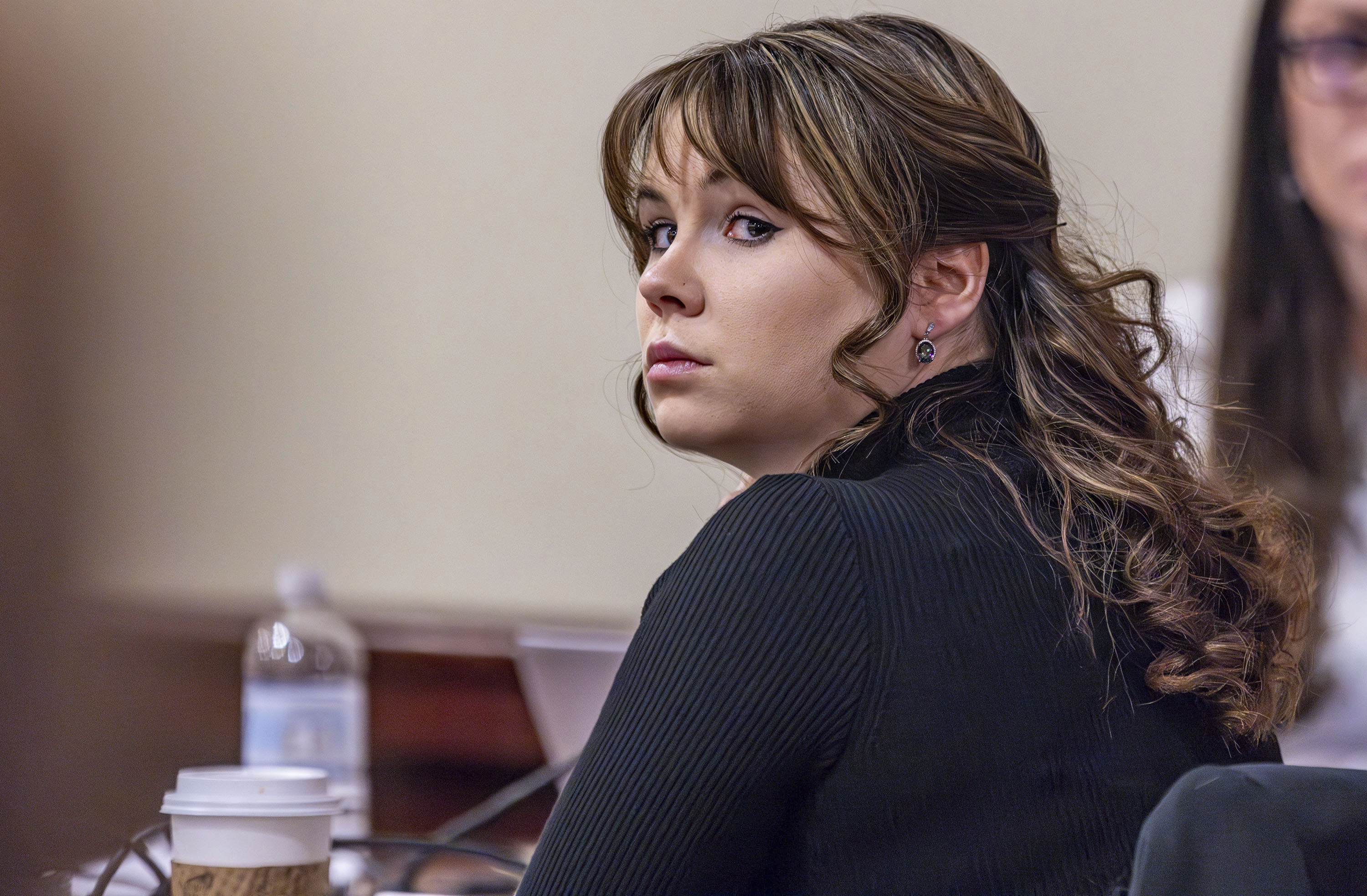 FILE - Hannah Gutierrez-Reed, the former armorer at the movie "Rust," listens to closing arguments in her trial at district court, Wednesday, March 6, 2024, in Santa Fe, N.M. The movie weapons armorer is appealing her conviction for involuntary manslaughter in the fatal shooting of a cinematographer by Alec Baldwin on the set of the Western film “Rust.” In court documents released Tuesday, May 14, 2024 a defense attorney for Gutierrez-Reed filed a notice of appeal of the March conviction by a jury. (Luis Sánchez Saturno/Santa Fe New Mexican via AP, Pool, File)