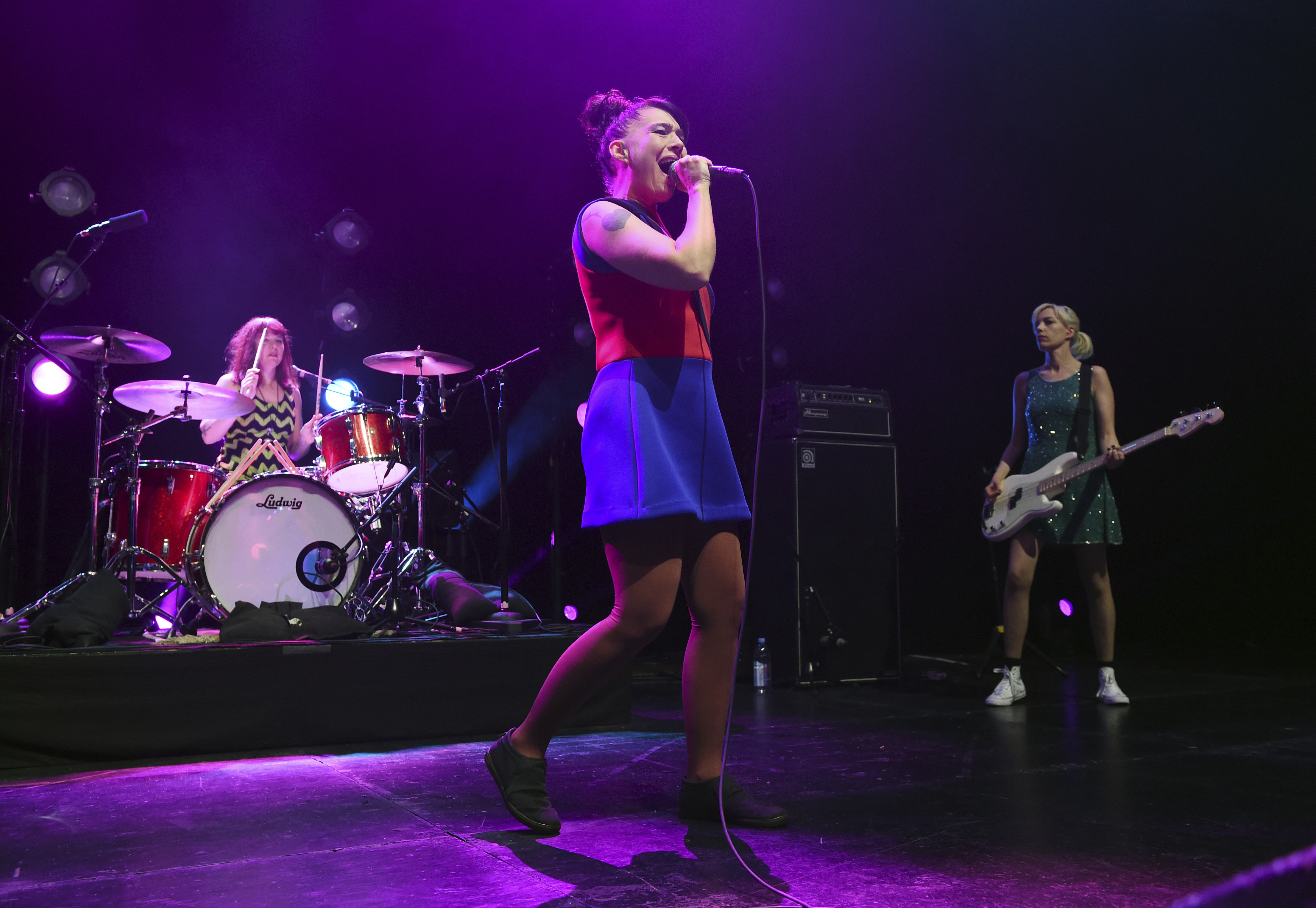 FILE - Kathleen Hanna, center, Tobi Vail, left, and Erica Dawn Lyle of the punk rock band Bikini Kill performs at the Hollywood Palladium in Los Angeles on May 2, 2019. Hanna released a memoir "Rebel Girl: My Life as a Feminist Punk." (Photo by Chris Pizzello/Invision/AP, File)