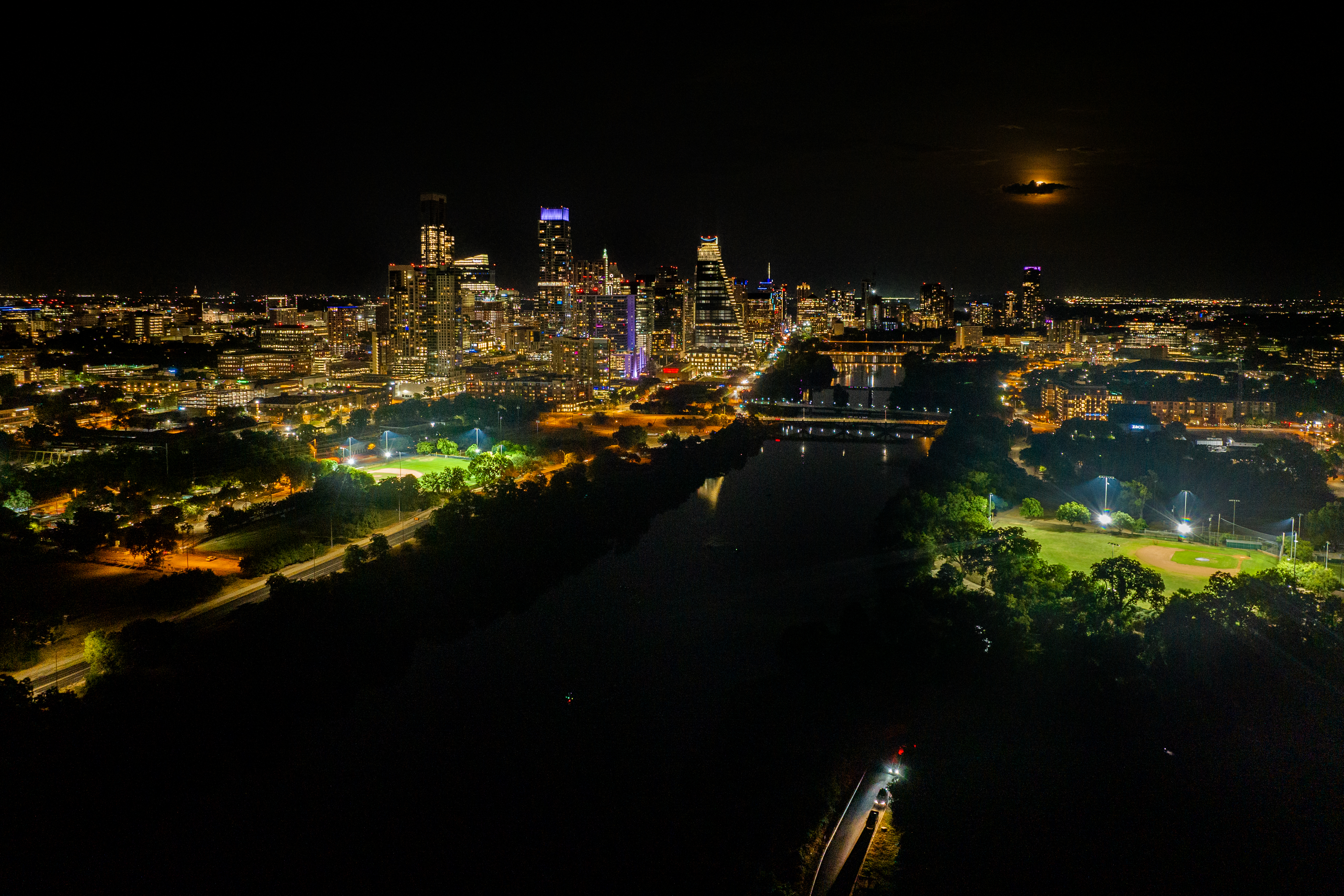 In an aerial view, the Sturgeon Supermoon rises over the downtown skyline on August 01, 2023 in Austin, Texas. (Photo by Brandon Bell/Getty Images)